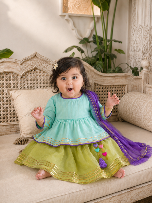 Mint green peplum kurta with olive green tulle skirt and purple dupatta with heart tassels for baby girl