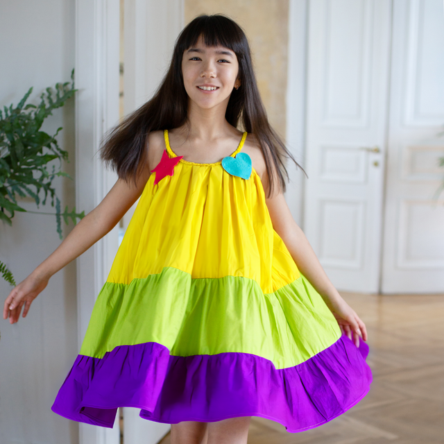 Girl wearing Anaario Serene Moon River Dress, Aqua Magic Print
