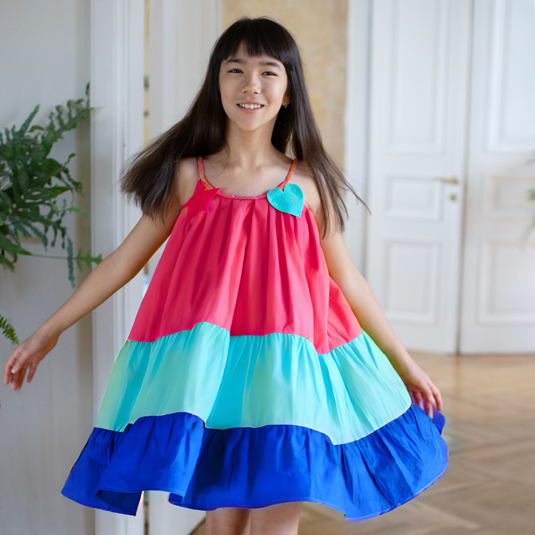 Girl wearing Anaario Serene Moon River Dress, Aqua Magic Print