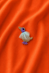 Bird embroidered motif, close-up detail
