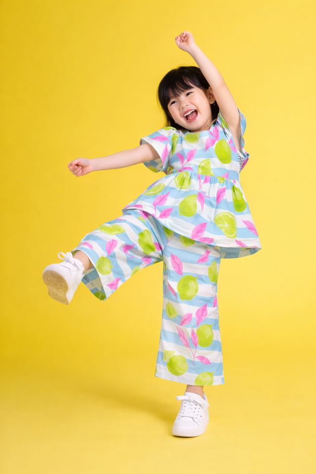 Girl wearing Anaario Neon Limes and Leaves Co-ord Set