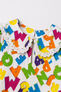 Girl wearing Anaario Neon Multicolor Alphabets Night Suit