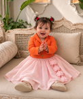 Orange jacket-style top with gold flamingo embroidery and blush pink flared lehenga skirt for baby girl
