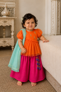 Orange puff sleeve peplum top with gold parrot embroidery, hot pink palazzo pants and turquoise dupatta for baby girl
