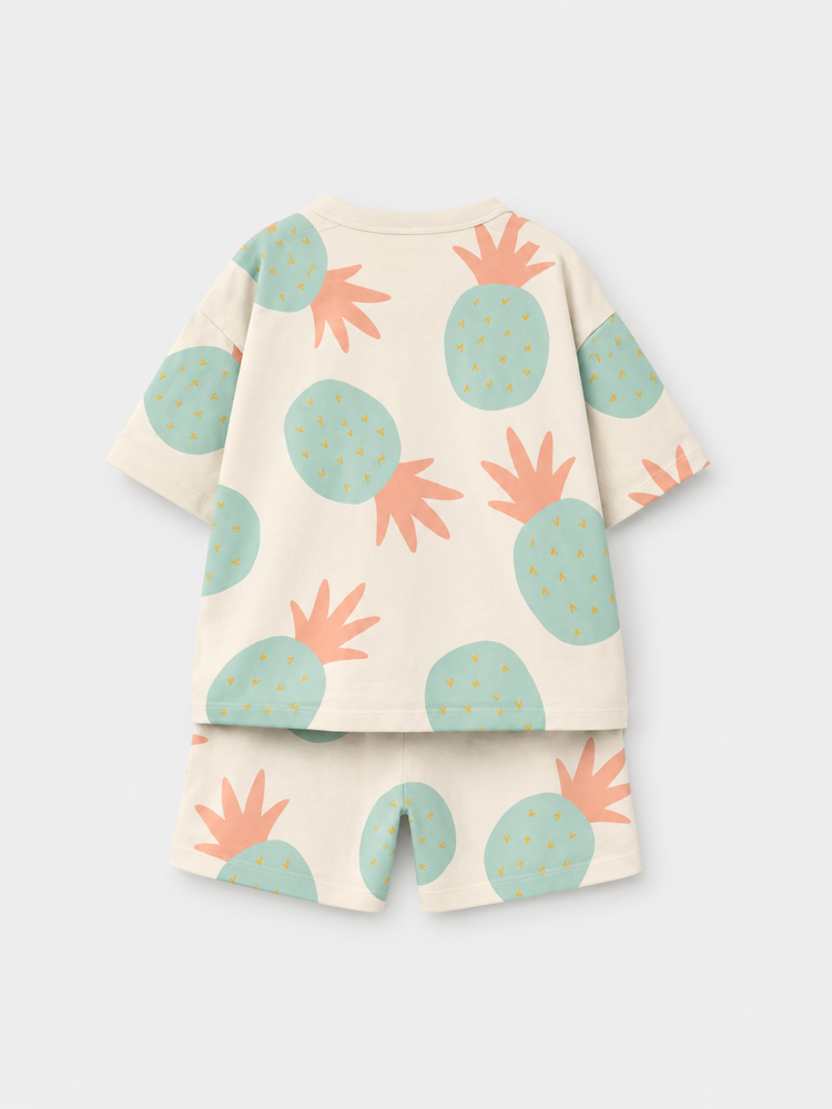 Boy wearing Anaario Pineapple Punch Co-ord Set, sage green pineapple print