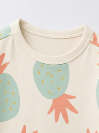 Boy wearing Anaario Pineapple Punch Co-ord Set, sage green pineapple print