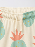 Boy wearing Anaario Pineapple Punch Co-ord Set, sage green pineapple print