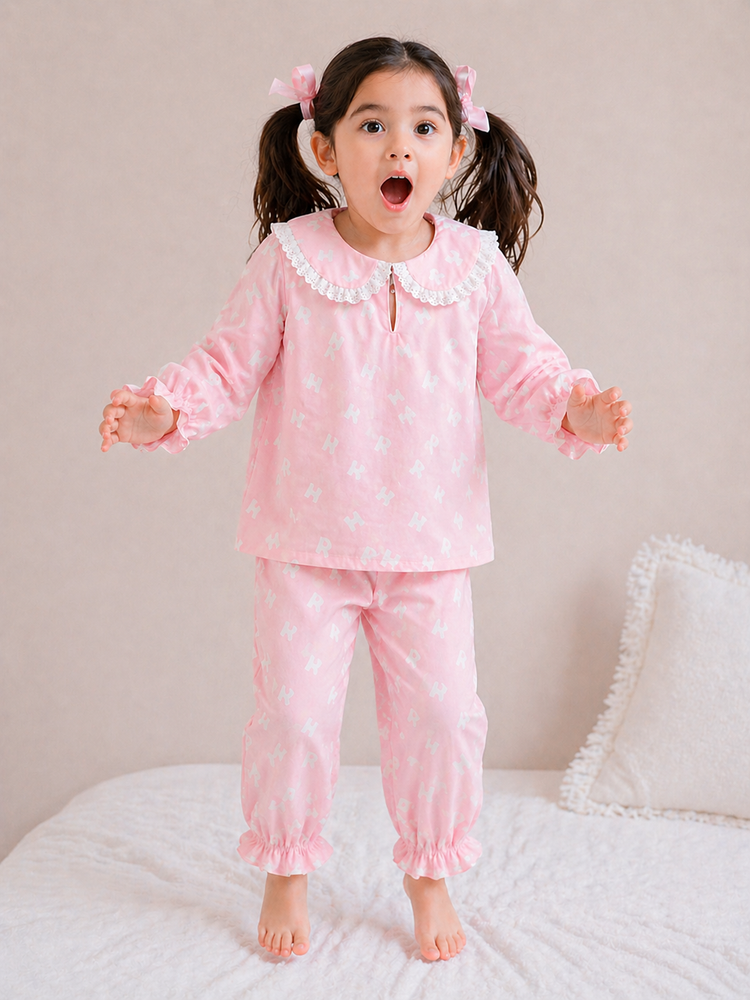 Girl wearing Anaario Pink Alphabet Night Suit