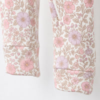 Pink Floral bamboo cotton baby sleepsuit — bamboo cotton onesie romper flatlay