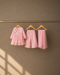 Anaario Pink Parrot Angrakha Set, pink angrakha top, pants and dupatta on hangers