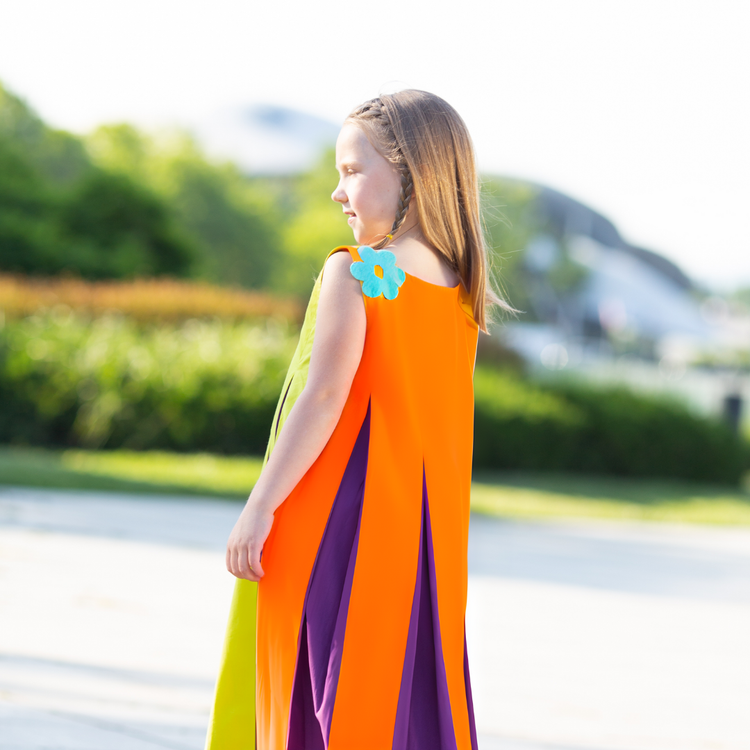 Girl wearing Anaario Pixie Dixie colorblock maxi dress in lime green, purple, and orange