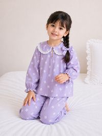Girl wearing Anaario Purple Alphabet Night Suit