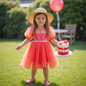 Girl wearing Anaario Coral Blossom Princess Dress, coral puff-sleeve tulle dress with beaded bodice