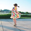 Girl wearing Anaario Rainbow Prism Dress