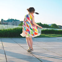 Girl wearing Anaario Rainbow Prism Dress