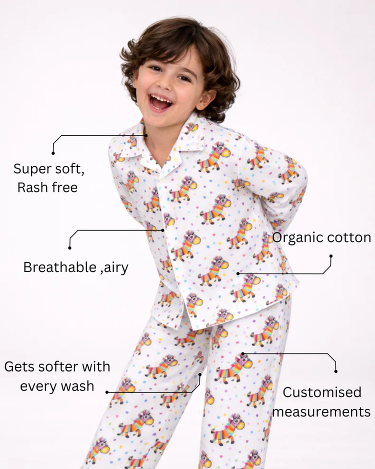Boy wearing Anaario Rainbow Zebra Night Suit