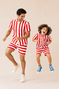 Boy wearing Anaario Red Stripe Shirt, red and white striped shirt, shown styled with matching shorts