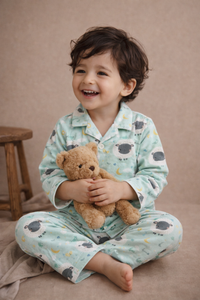 Boy wearing Anaario Sheep and Night Sky Night Suit