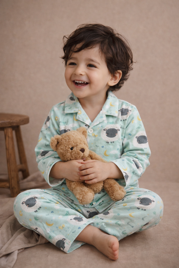 Boy wearing Anaario Sheep and Night Sky Night Suit