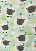 Baby wearing Anaario Sheep and Nightsky organic cotton pyjama set, newborn to 24 months