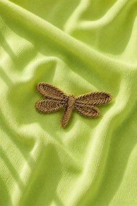 Dragonfly embroidered motif, close-up detail