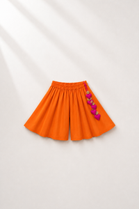 Anaario Teal Orange Peplum Co-ord Set, orange palazzo pants flat lay with heart-charm tassel