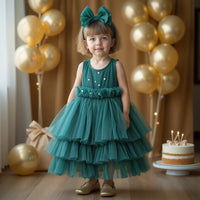 Girl wearing Anaario Emerald Tiered Tiara Dress, emerald green tiered tulle dress with beaded bodice
