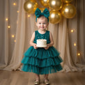 Girl wearing Anaario Emerald Tiered Tiara Dress, emerald green tiered tulle dress with beaded bodice
