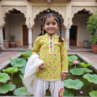 Girl wearing Anaario Lime-Poppy Patiala Set, lime yellow floral print kurta with white patiala pants and cream dupatta