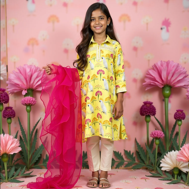 Girl wearing Anaario Marigold Meadow Anarkali Set, marigold yellow floral and bird print kurta with hot pink dupatta