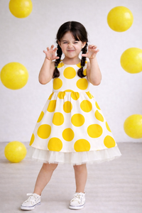 Girl wearing Anaario Sun-Kissed Polka Dress