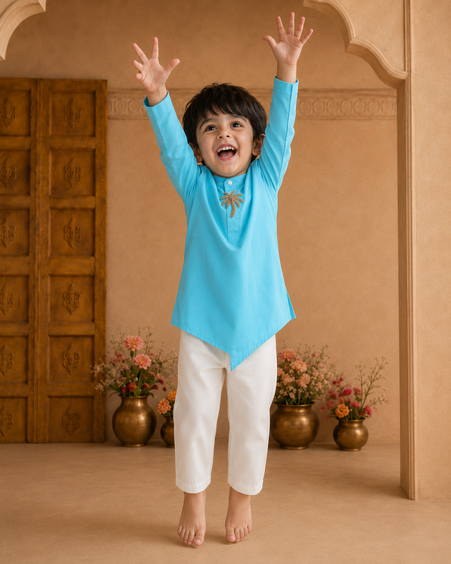 Turquoise palm-motif asymmetrical kurta - boy jumping under arch