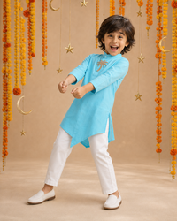 Turquoise palm-motif asymmetrical kurta - boy dancing