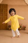 Yellow moon and star asymmetrical kurta by Anaario - boy pose 1