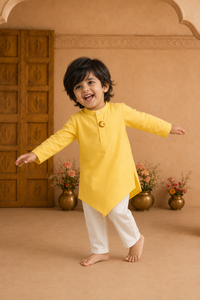 Yellow moon and star asymmetrical kurta by Anaario - boy pose 1
