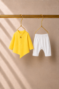 Baby wearing Anaario Yellow Moon-Star Baby Kurta Set, yellow kurta with moon-and-star embroidered jacket, newborn to 24 months
