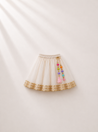 Anaario Yellow Peplum Lehenga Set, cream lehenga skirt flat lay with gold trim and heart tassel