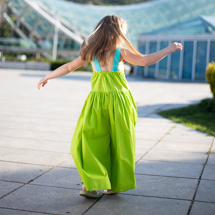 Girl wearing Anaario Cosmic Bewitched Jumpsuit, Aqua Magic Print