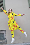 Person wearing Anaario Casablanca Co-ord Set, yellow duster with black star and coral brushstroke print over matching pants
