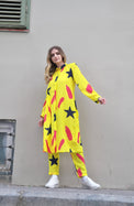 Person wearing Anaario Casablanca Co-ord Set, yellow duster with black star and coral brushstroke print over matching pants