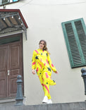 Person wearing Anaario Casablanca Co-ord Set, yellow duster with black star and coral brushstroke print over matching pants