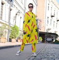 Person wearing Anaario Casablanca Co-ord Set, yellow duster with black star and coral brushstroke print over matching pants