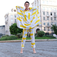 Person wearing Anaario City Girl Co-ord Set, white and yellow abstract print oversized top and matching pants