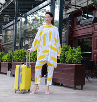 Person wearing Anaario City Girl Co-ord Set, white and yellow abstract print oversized top and matching pants