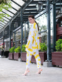 Person wearing Anaario City Girl Co-ord Set, white and yellow abstract print oversized top and matching pants