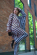 Person wearing Anaario City Girl Co-ord Set, mixed burgundy and navy stripe shirt and matching pants