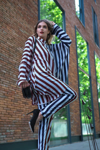 Person wearing Anaario City Girl Co-ord Set, mixed burgundy and navy stripe shirt and matching pants