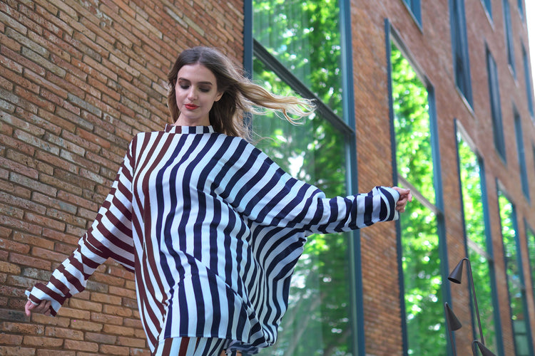 Person wearing Anaario City Girl Co-ord Set, mixed burgundy and navy stripe shirt and matching pants