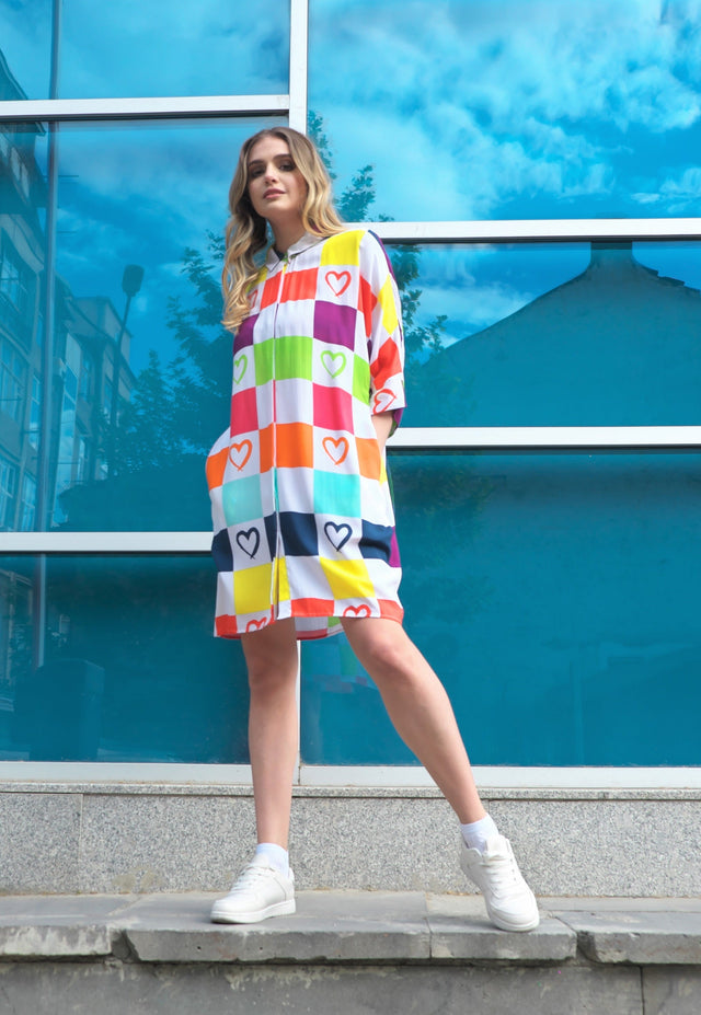 Woman wearing Anaario K-Pop Krush Shirt Dress, multicolor checkered oversized shirt dress with heart print