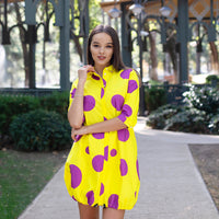 Woman wearing Anaario Katy Perry Bubble Hem Dress, yellow dress with purple polka dot print and bubble hem